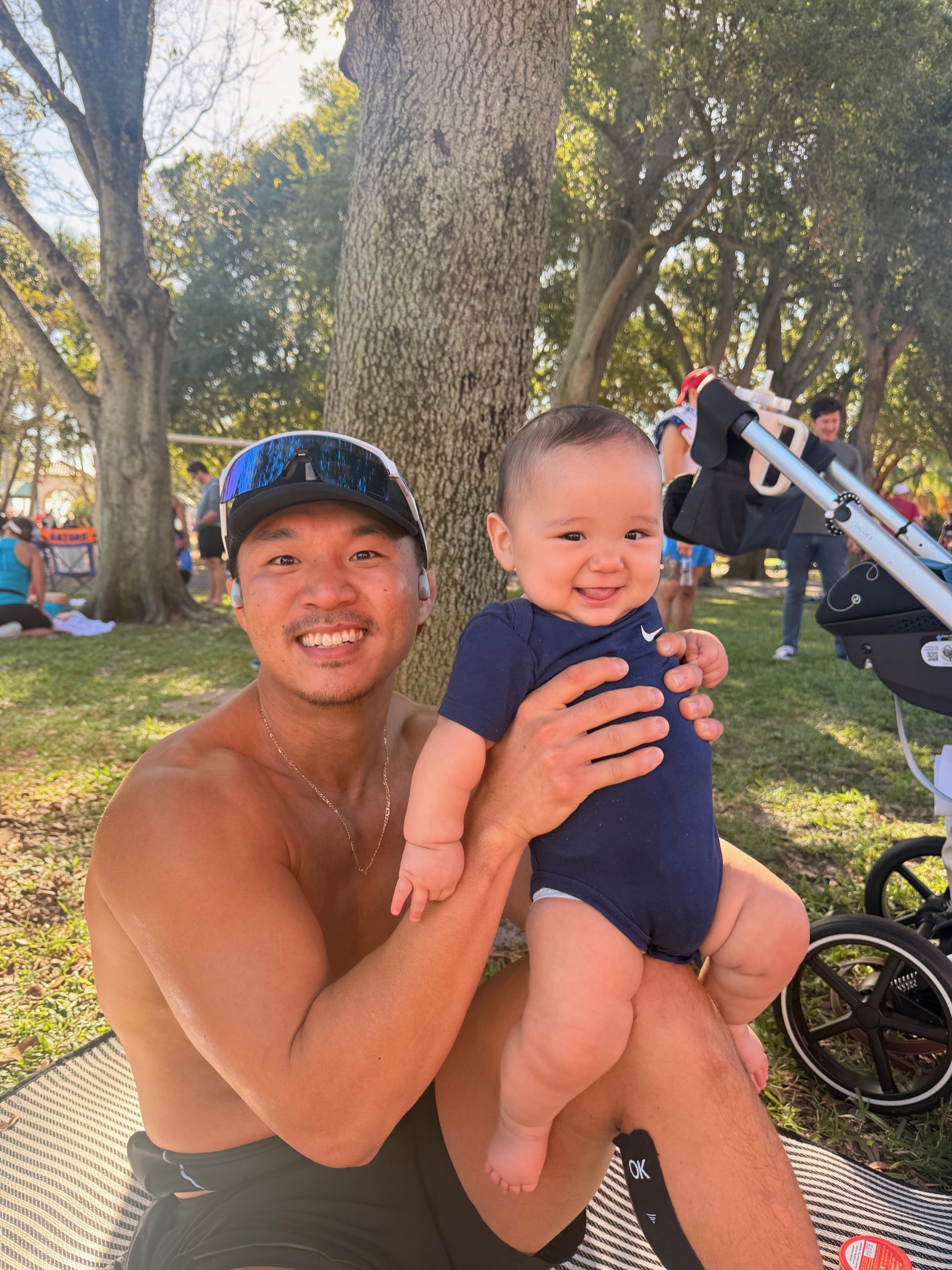 Jae holding his son Roman after a run
