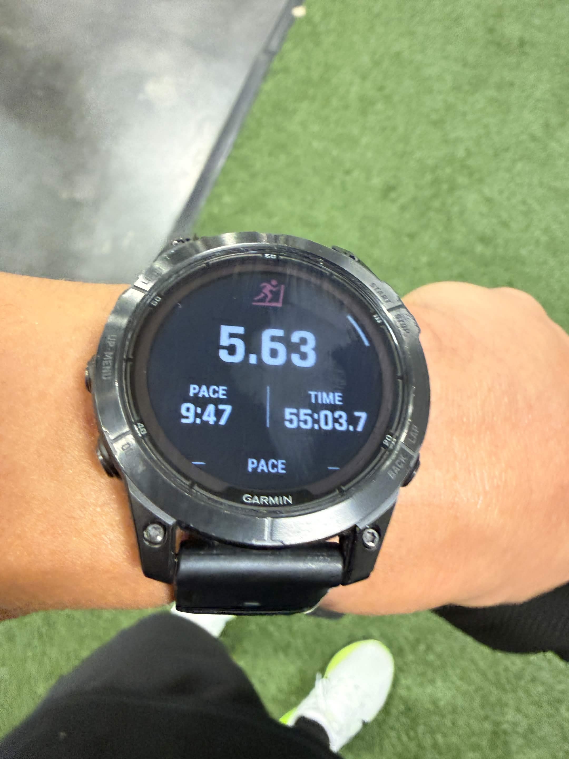 Garmin Fenix 7 Pro showing 5.63 miles, 9:47 pace, 55:03 elapsed.