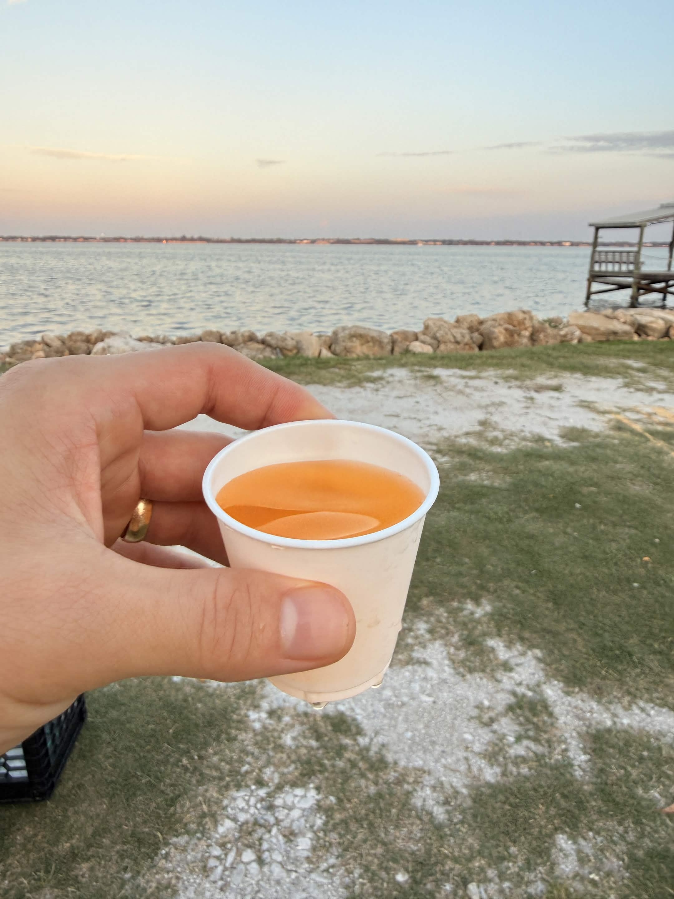 Orange Gatorade in hand at the waterfront — that's the whole reward.